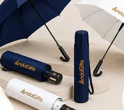 Navy and white umbrellas with Andol Gifts branding, open and folded